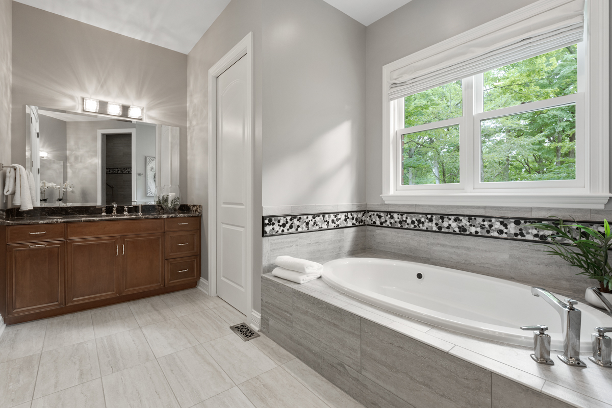 2-s291 Nelson Lake Road Batavia, IL 60510 - Photo 23 of 57 a bathroom with a bathtub a mirror a sinks and a shower