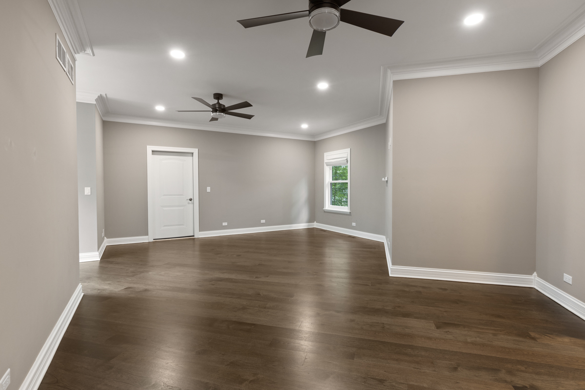 2-s291 Nelson Lake Road Batavia, IL 60510 - Photo 25 of 57 an empty room with wooden floor and windows