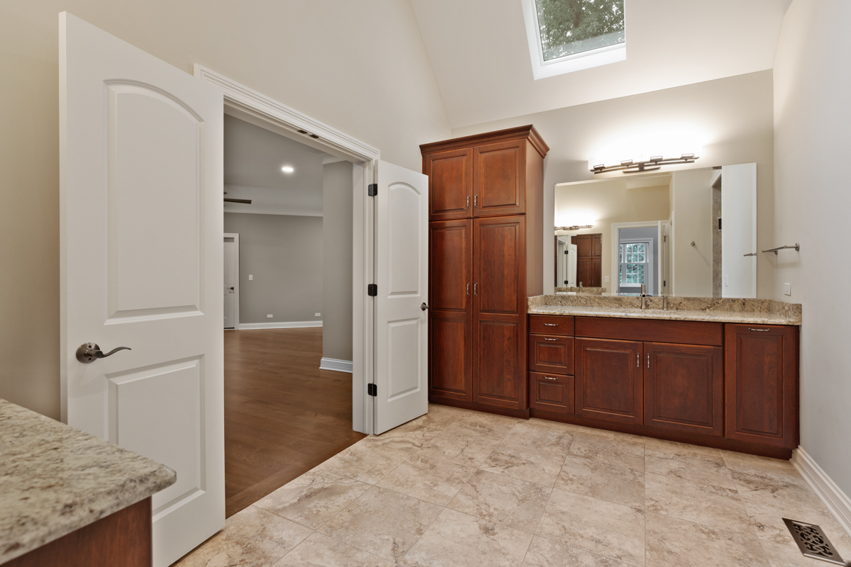 2-s291 Nelson Lake Road Batavia, IL 60510 - Photo 29 of 57 a bathroom with a granite countertop sink and a mirror