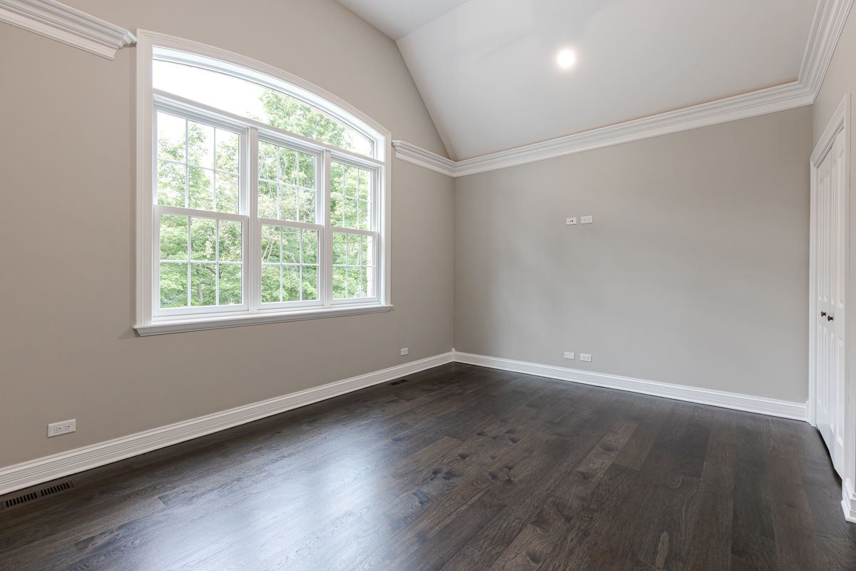 2-s291 Nelson Lake Road Batavia, IL 60510 - Photo 31 of 57 an empty room with wooden floor and windows
