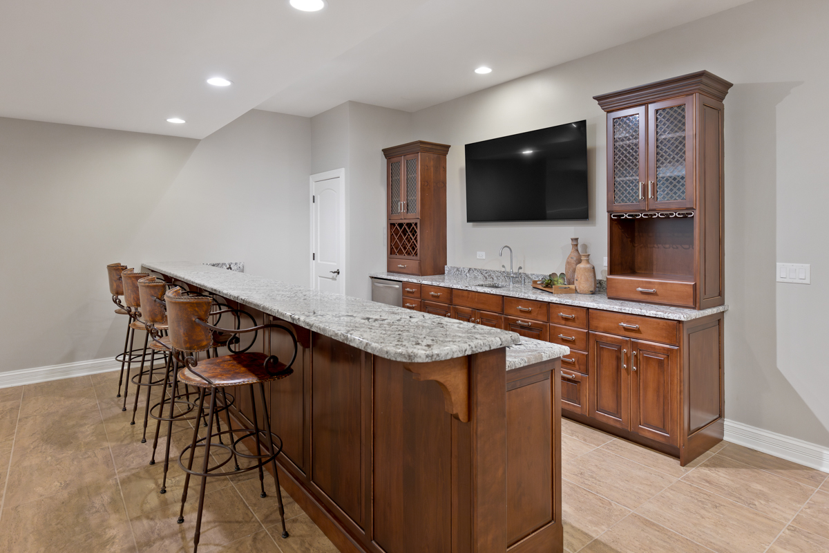 2-s291 Nelson Lake Road Batavia, IL 60510 - Photo 40 of 57 a kitchen with stainless steel appliances kitchen island granite countertop a sink and a microwave