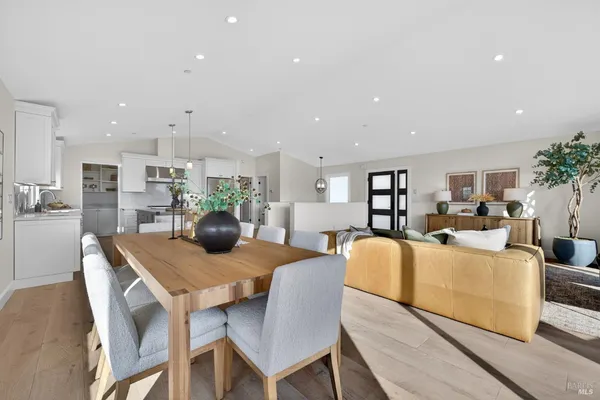 a kitchen with stainless steel appliances granite countertop a stove and a sink