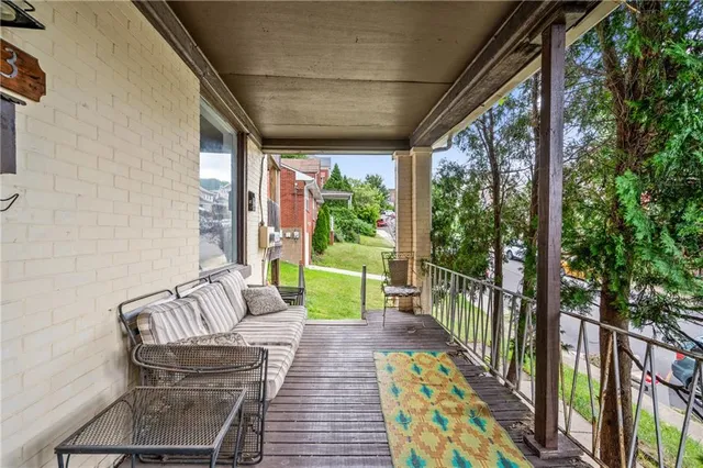 a view of two chairs in the balcony