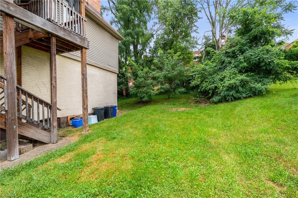 823 Lilac Street, Unit 1 Greenfield, PA 15217 - Photo 5 of 20 a view of a house with a yard