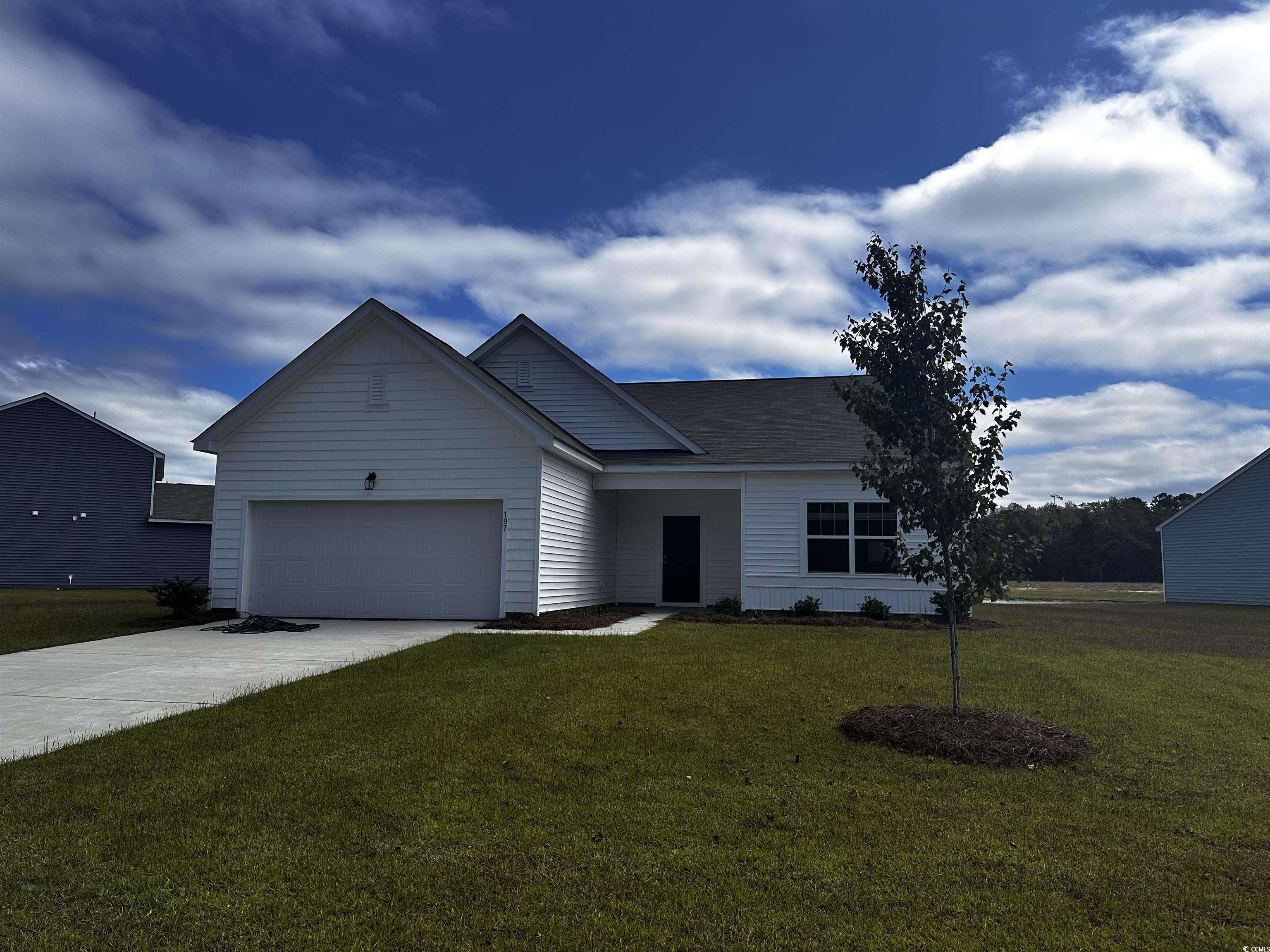 View of front of home featuring a front lawn and a
