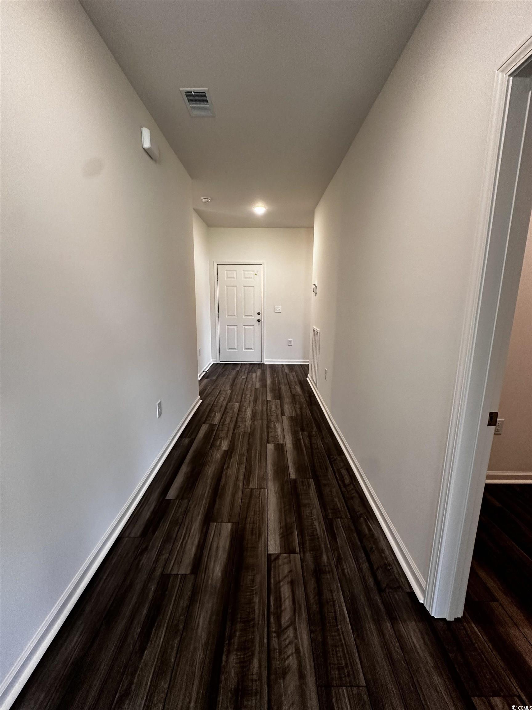 197 Linares Street Loris, SC 29569 - Photo 17 of 26 Hallway featuring wood-type flooring