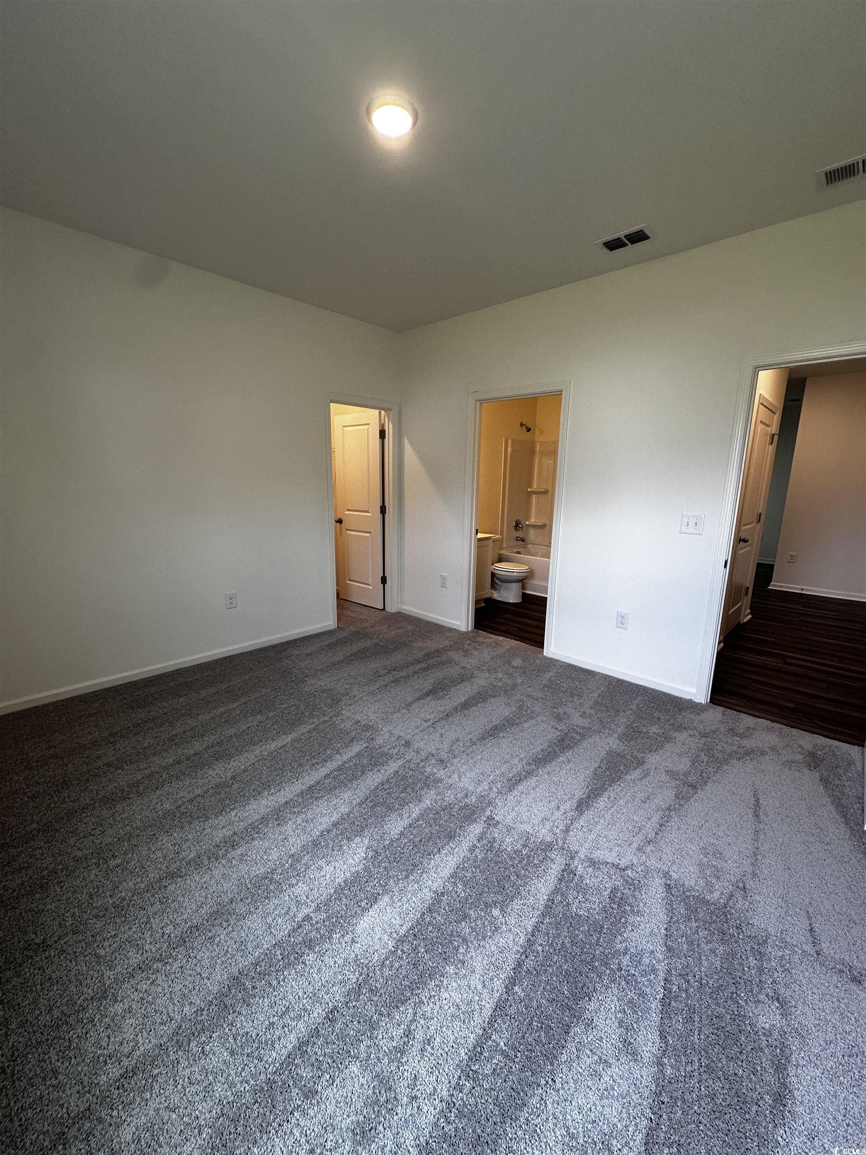 197 Linares Street Loris, SC 29569 - Photo 22 of 26 Unfurnished bedroom featuring dark colored carpet