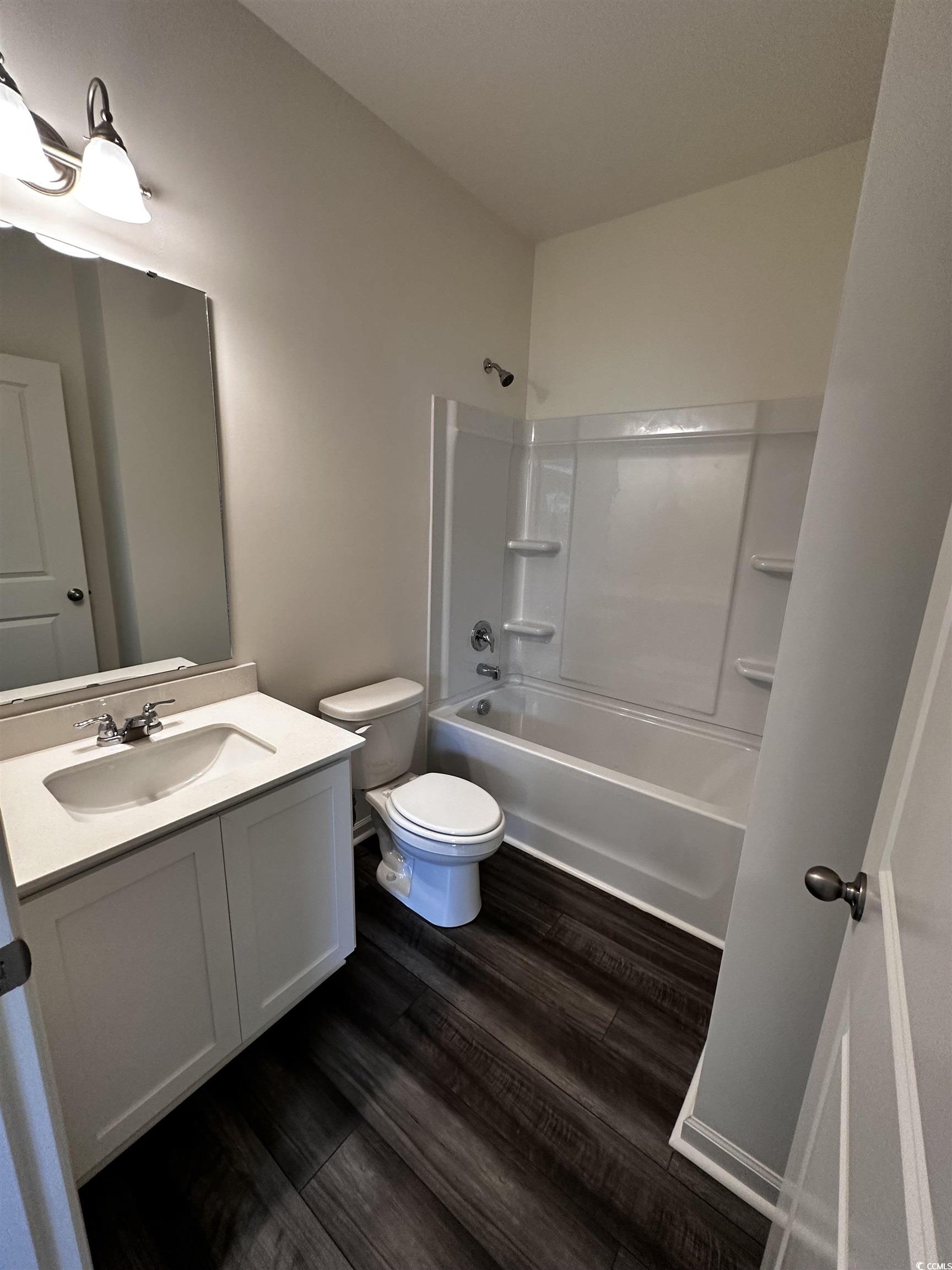 197 Linares Street Loris, SC 29569 - Photo 23 of 26 Full bathroom featuring toilet, hardwood / wood-st