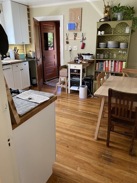 44 Webster Street, Unit 1 Arlington, MA 02474 - Photo 3 of 15 a living room with furniture and wooden floor