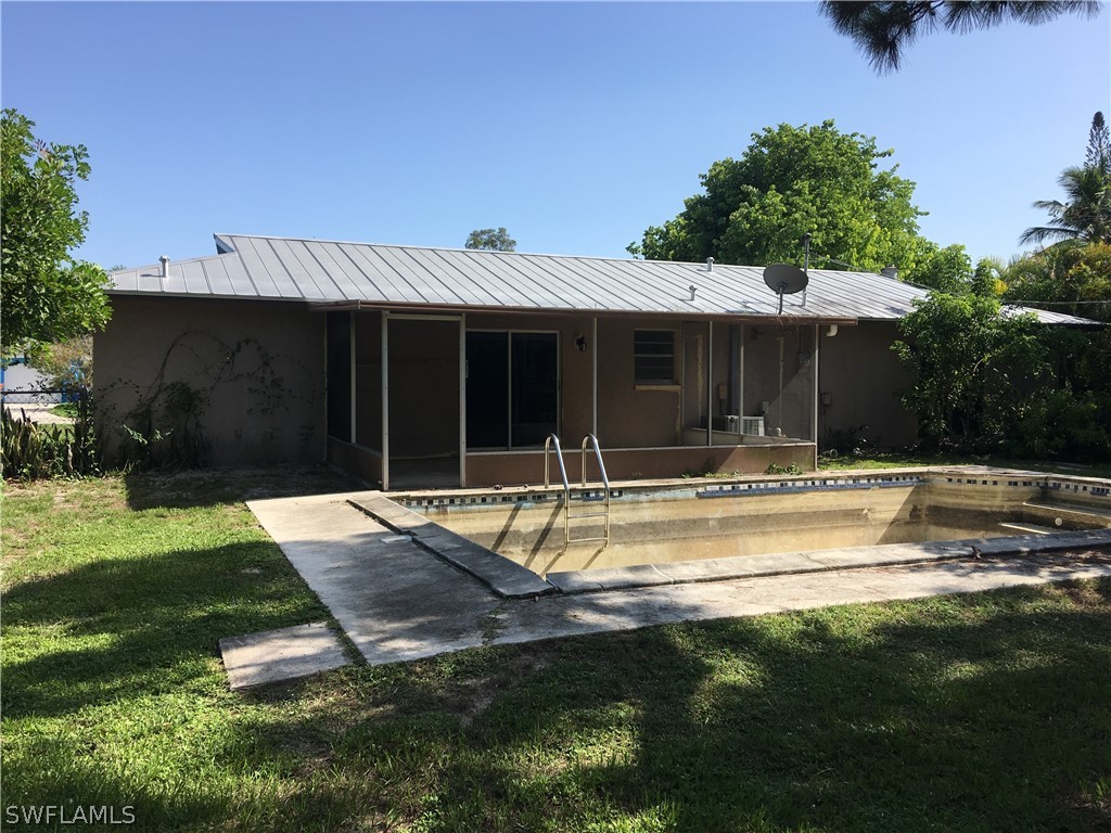 7229 Myrtle Road Fort Myers, FL 33967 - Photo 2 of 15 a view of a house with swimming pool and yard