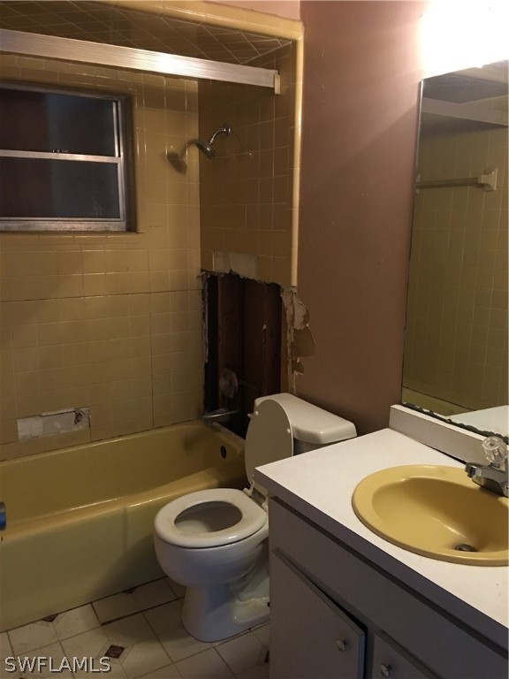 7229 Myrtle Road Fort Myers, FL 33967 - Photo 8 of 15 a bathroom with a granite countertop toilet sink and mirror