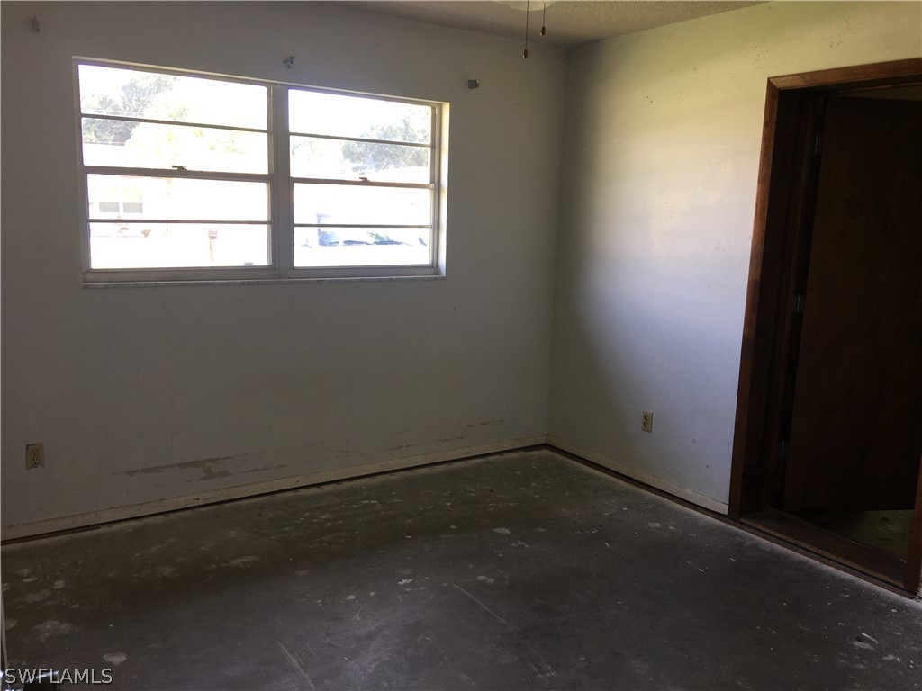 7229 Myrtle Road Fort Myers, FL 33967 - Photo 9 of 15 an empty room with a window