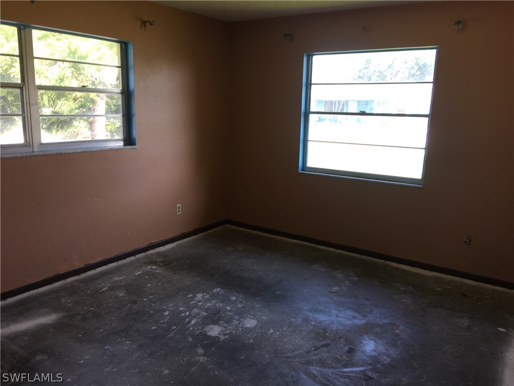 7229 Myrtle Road Fort Myers, FL 33967 - Photo 10 of 15 an empty room with a window