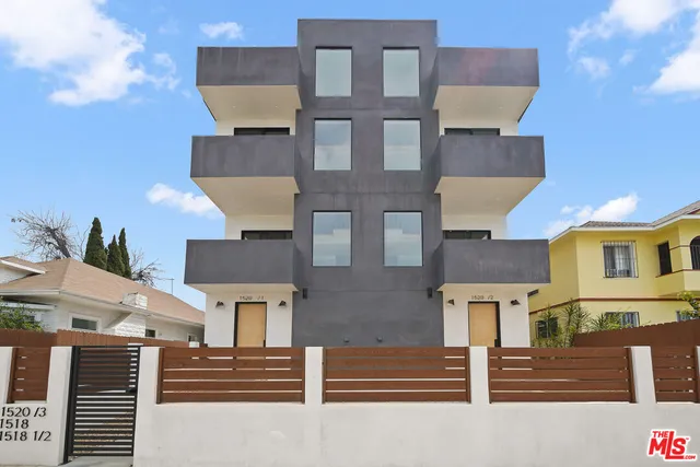 a front view of a house with a street