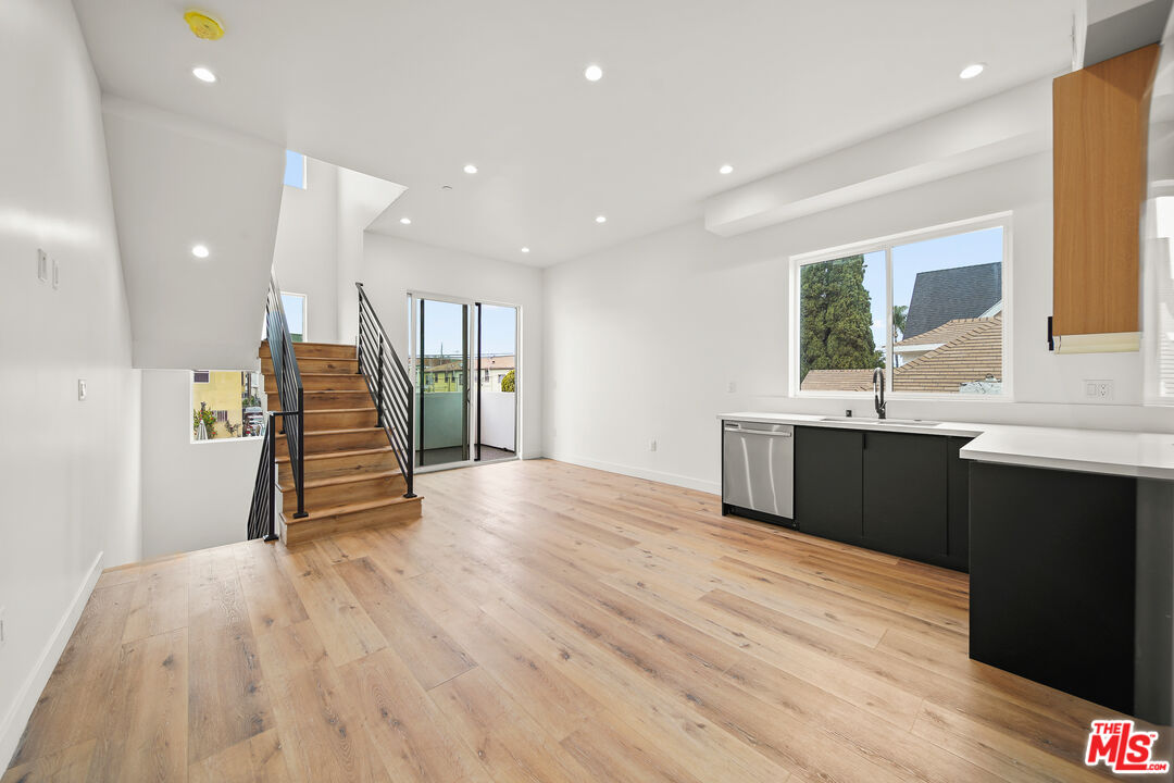 1520 Magnolia Avenue, Unit 1 Los Angeles, CA 90006 - Photo 3 of 21 a view of kitchen with refrigerator and window