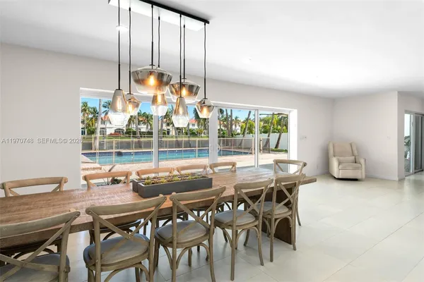 a view of a dining room with furniture window and outside view