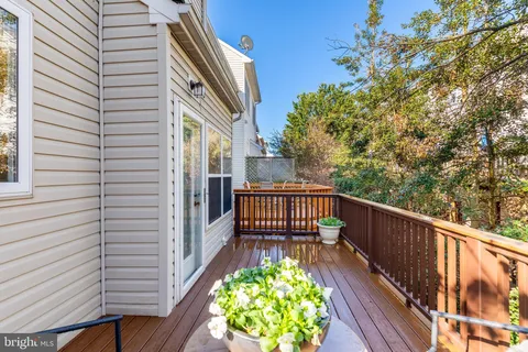 a view of a balcony with wooden floor