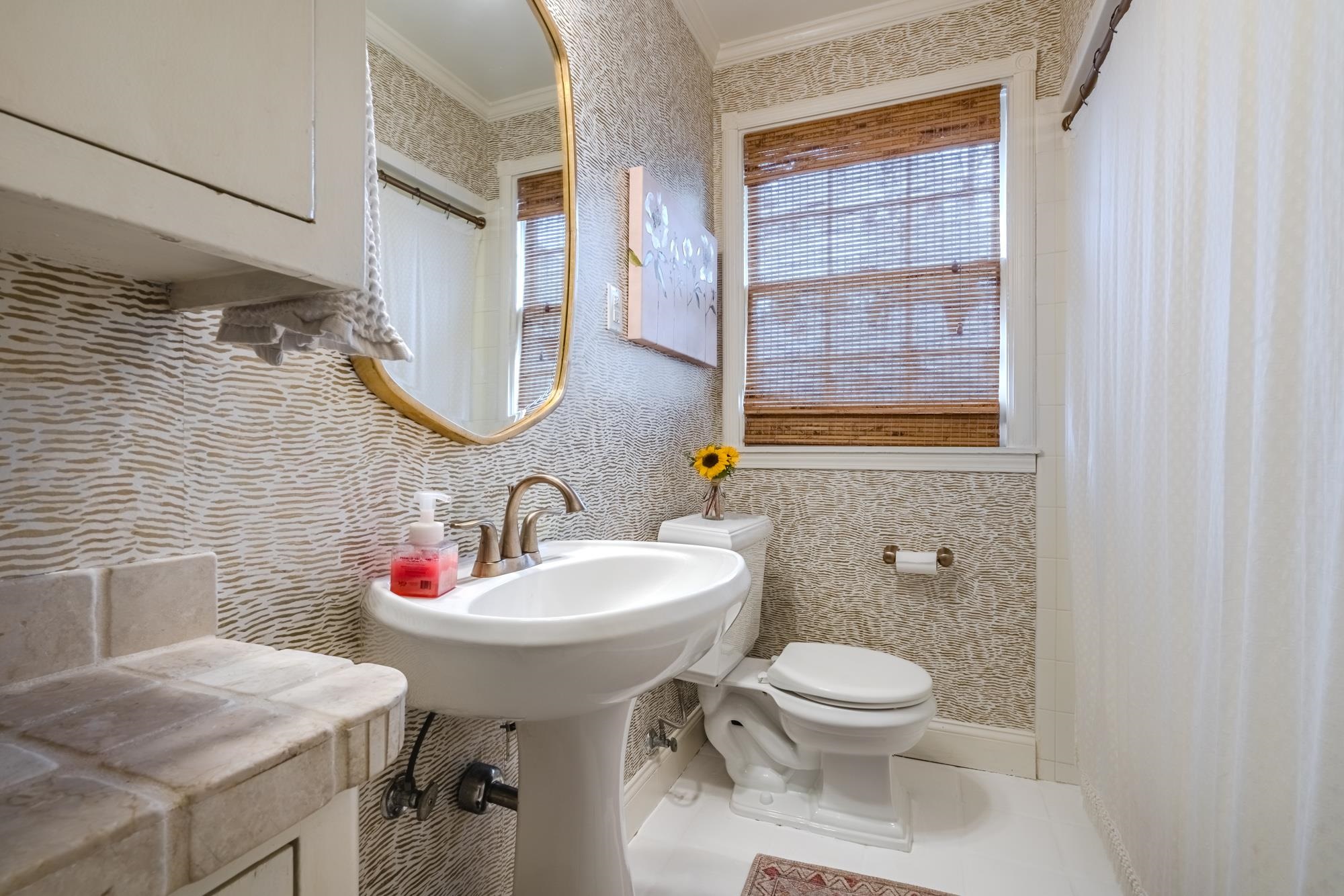 273 Ridgefield Road Memphis, TN 38111 - Photo 26 of 40 a bathroom with a sink a toilet and mirror