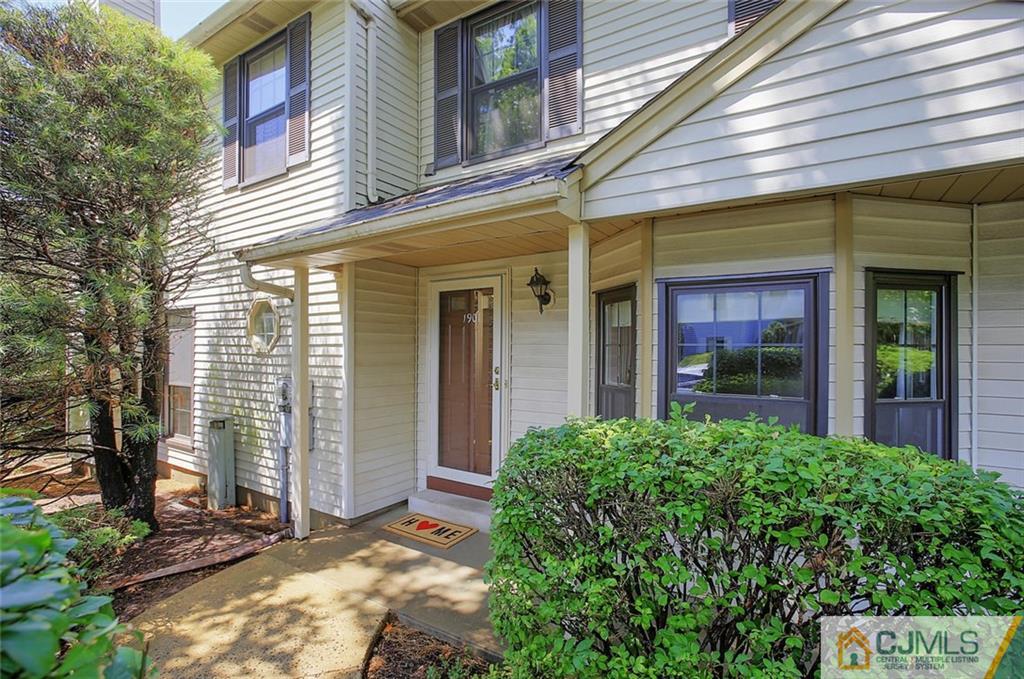 1901 Timber Oaks Road Edison, NJ 08820 - Photo 2 of 23 front view of a brick house with a large windows