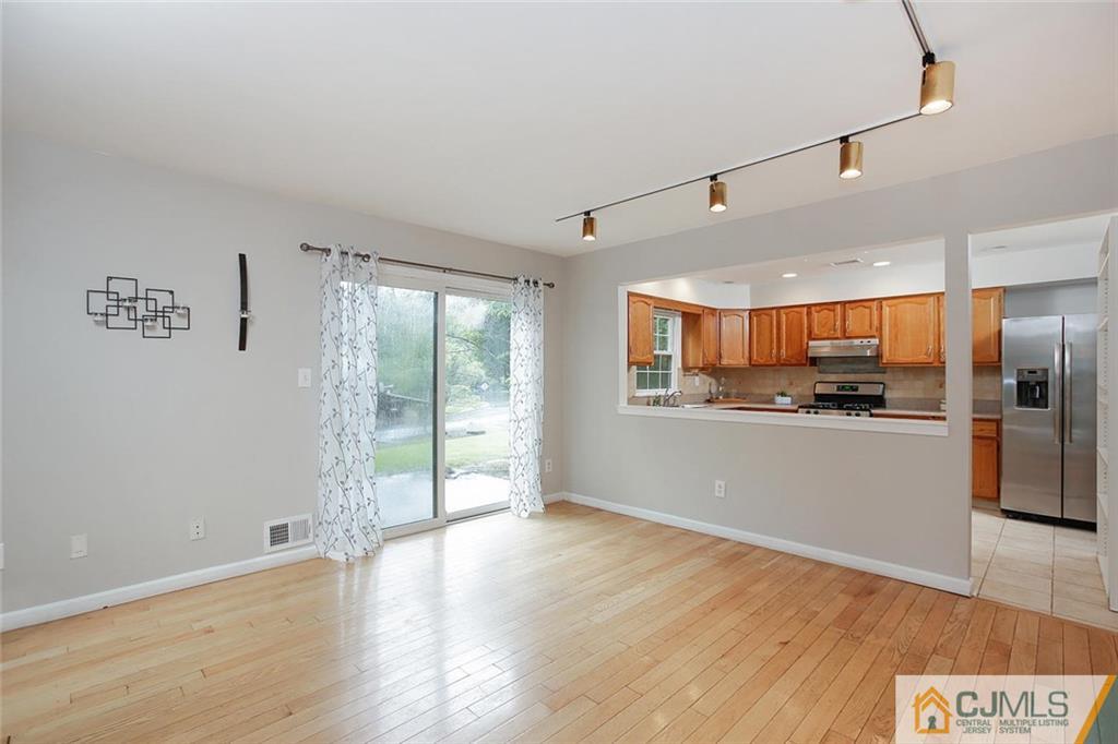 1901 Timber Oaks Road Edison, NJ 08820 - Photo 11 of 23 a view of a kitchen with wooden floor and electronic appliances
