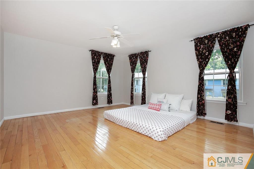 1901 Timber Oaks Road Edison, NJ 08820 - Photo 16 of 23 a bedroom with a bed and a window