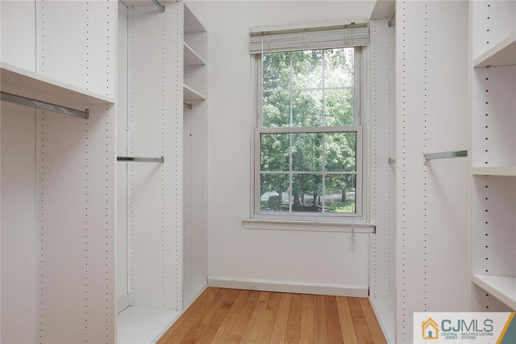 1901 Timber Oaks Road Edison, NJ 08820 - Photo 17 of 23 a view of an empty room with wooden floor and a window
