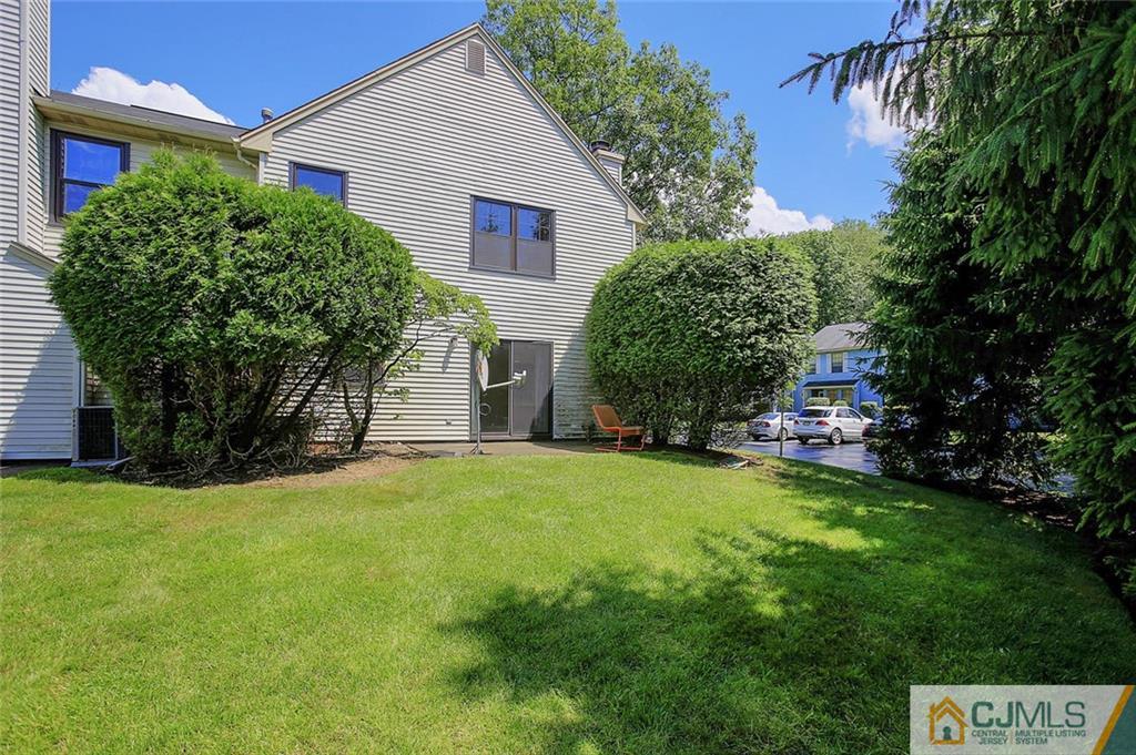 1901 Timber Oaks Road Edison, NJ 08820 - Photo 22 of 23 a front view of a house with a yard and garage