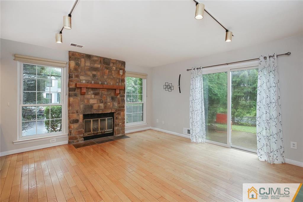 1901 Timber Oaks Road Edison, NJ 08820 - Photo 9 of 23 a view of a livingroom with a fireplace and window