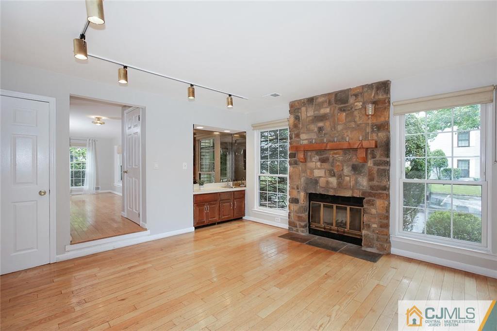 1901 Timber Oaks Road Edison, NJ 08820 - Photo 10 of 23 a view of a livingroom with a fireplace and window