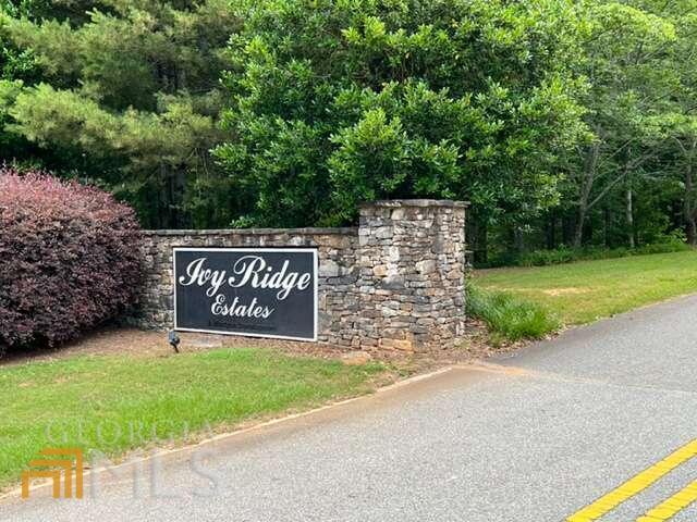 17 Arbor Way, Unit 17 Blue Ridge, GA 30513 - Photo 1 of 1 a sign that is sitting on a brick road
