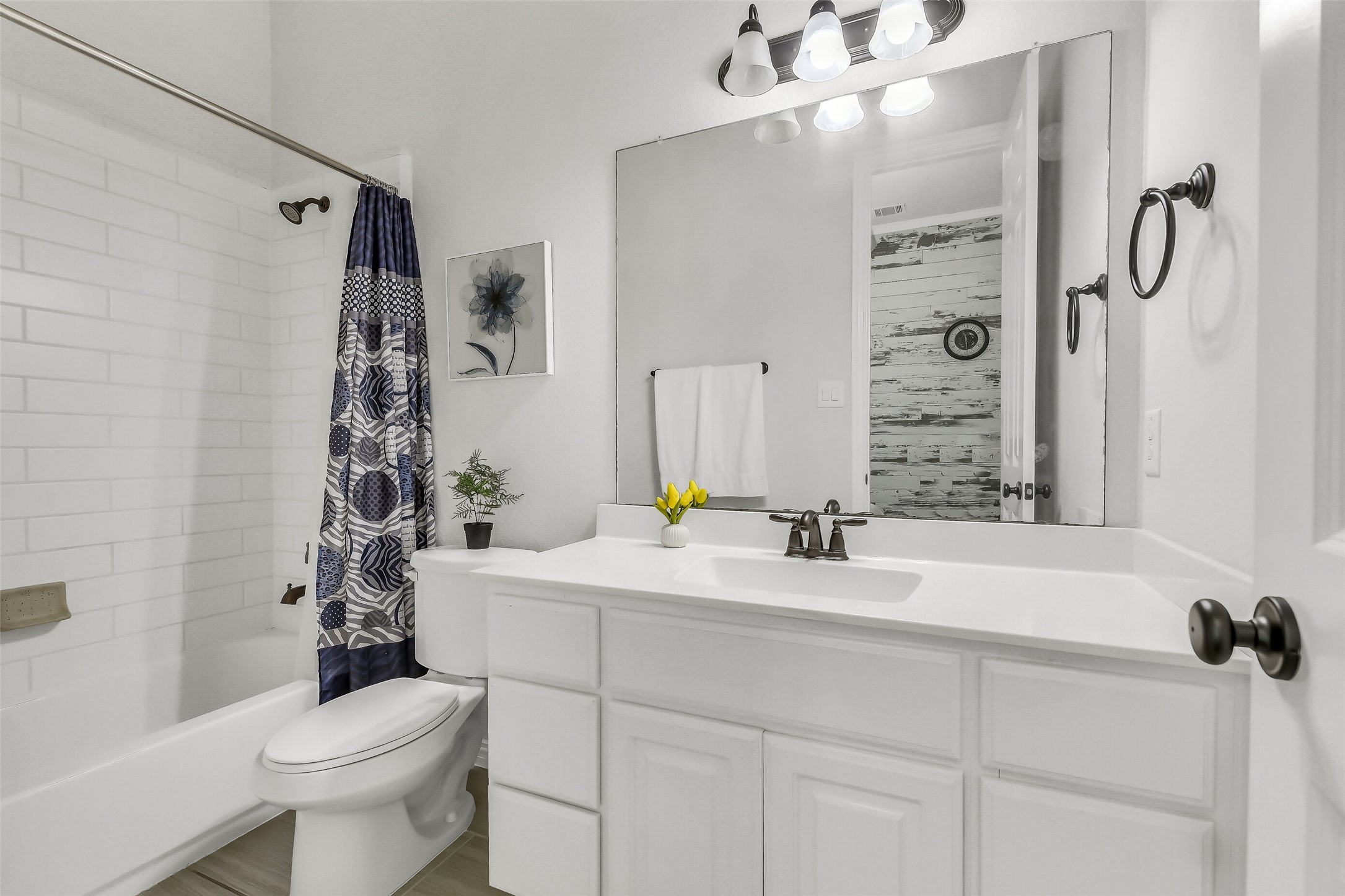12207 Shorebridge Road Cypress, TX 77433 - Photo 23 of 41 a bathroom with a sink and mirror with toilet