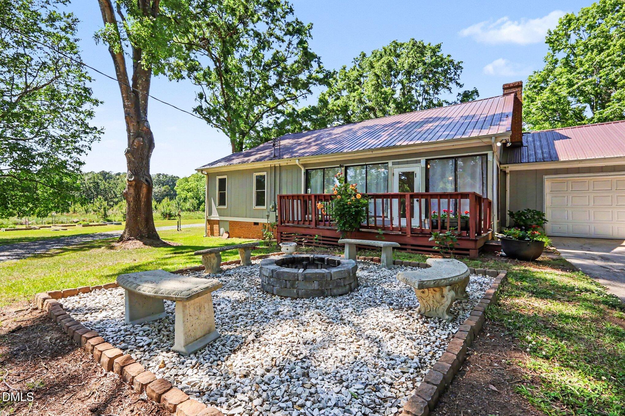 779 Steel Bridge Road Sanford, NC 27330 - Photo 4 of 37 Rear deck fire pit
