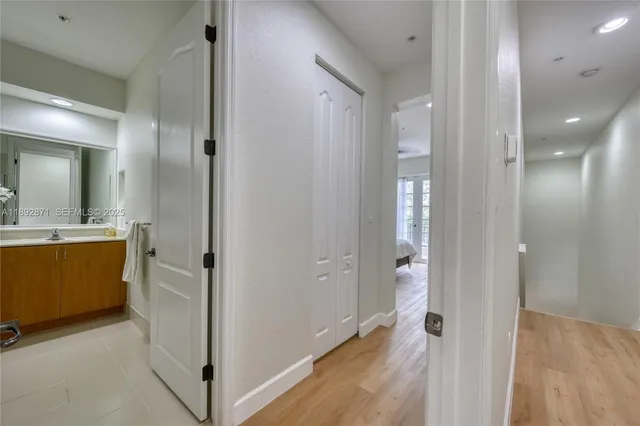 a bathroom with a mirror and a shower