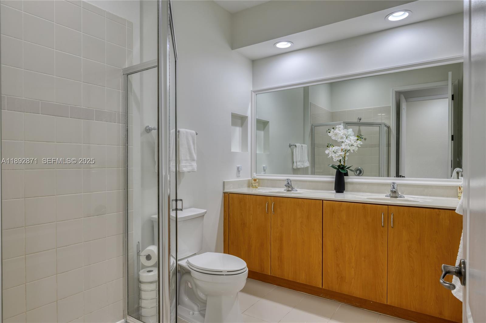 430 Southwest 147th Avenue Pembroke Pines, FL 33027 - Photo 16 of 36 a bathroom with a sink a toilet and shower