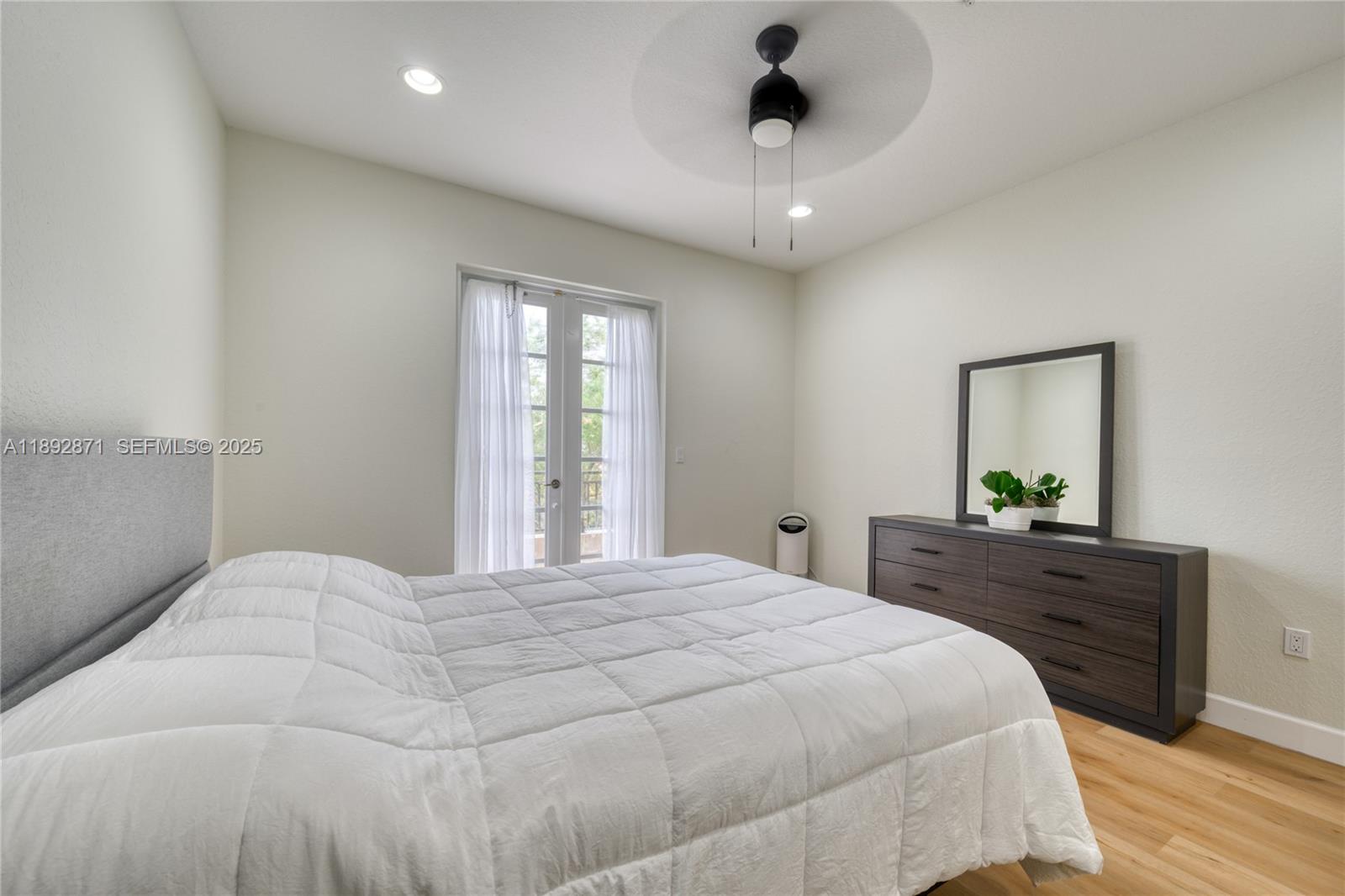 430 Southwest 147th Avenue Pembroke Pines, FL 33027 - Photo 19 of 36 a bedroom with a bed and a dresser