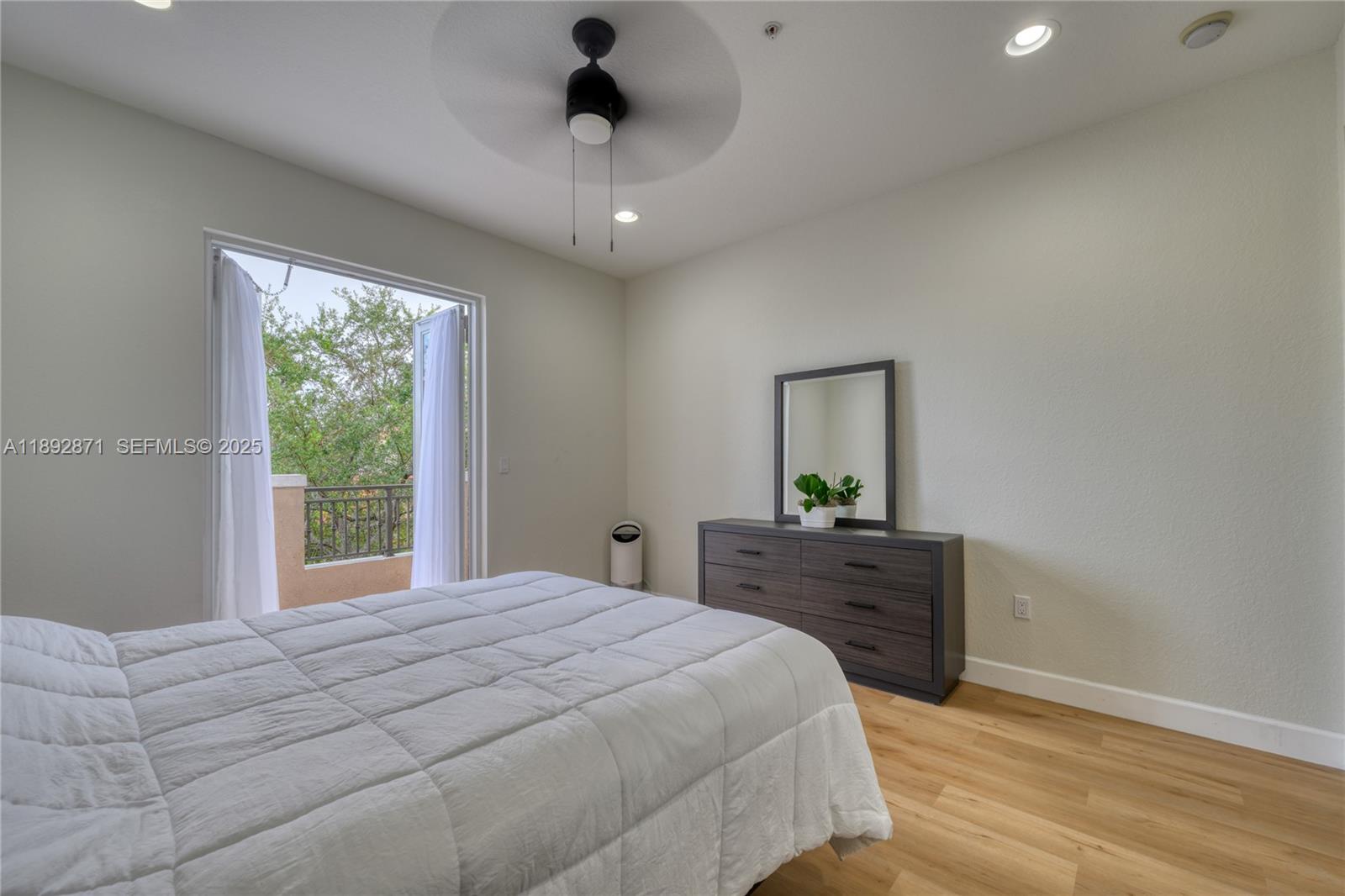 430 Southwest 147th Avenue Pembroke Pines, FL 33027 - Photo 22 of 36 a bedroom with a bed and a dresser