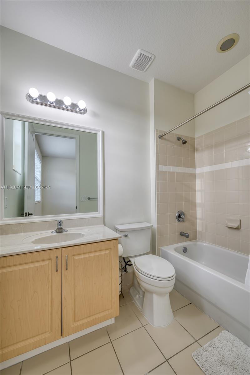 430 Southwest 147th Avenue Pembroke Pines, FL 33027 - Photo 27 of 36 a bathroom with a sink toilet vanity and tub
