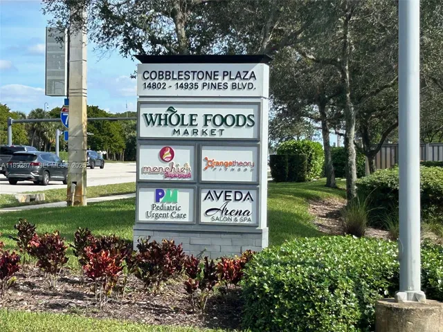 a sign that is on a pole on a street