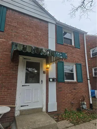 a front view of a house with an outdoor space