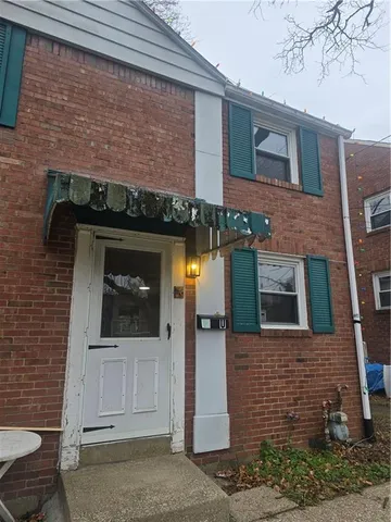 a front view of a house with an outdoor space
