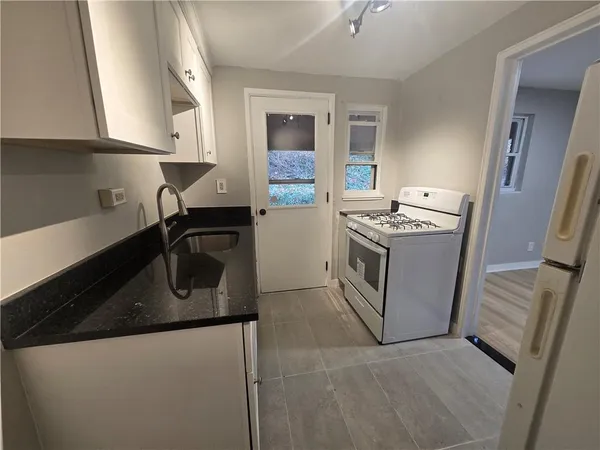 a kitchen with a stove and a sink