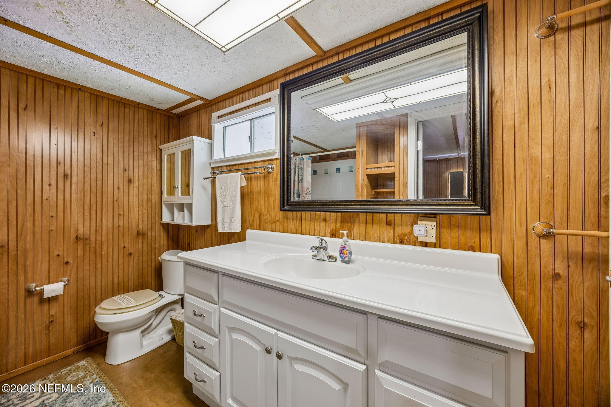15690 Sears Road Jacksonville, FL 32218 - Photo 14 of 27 a bathroom with a sink a toilet and shower