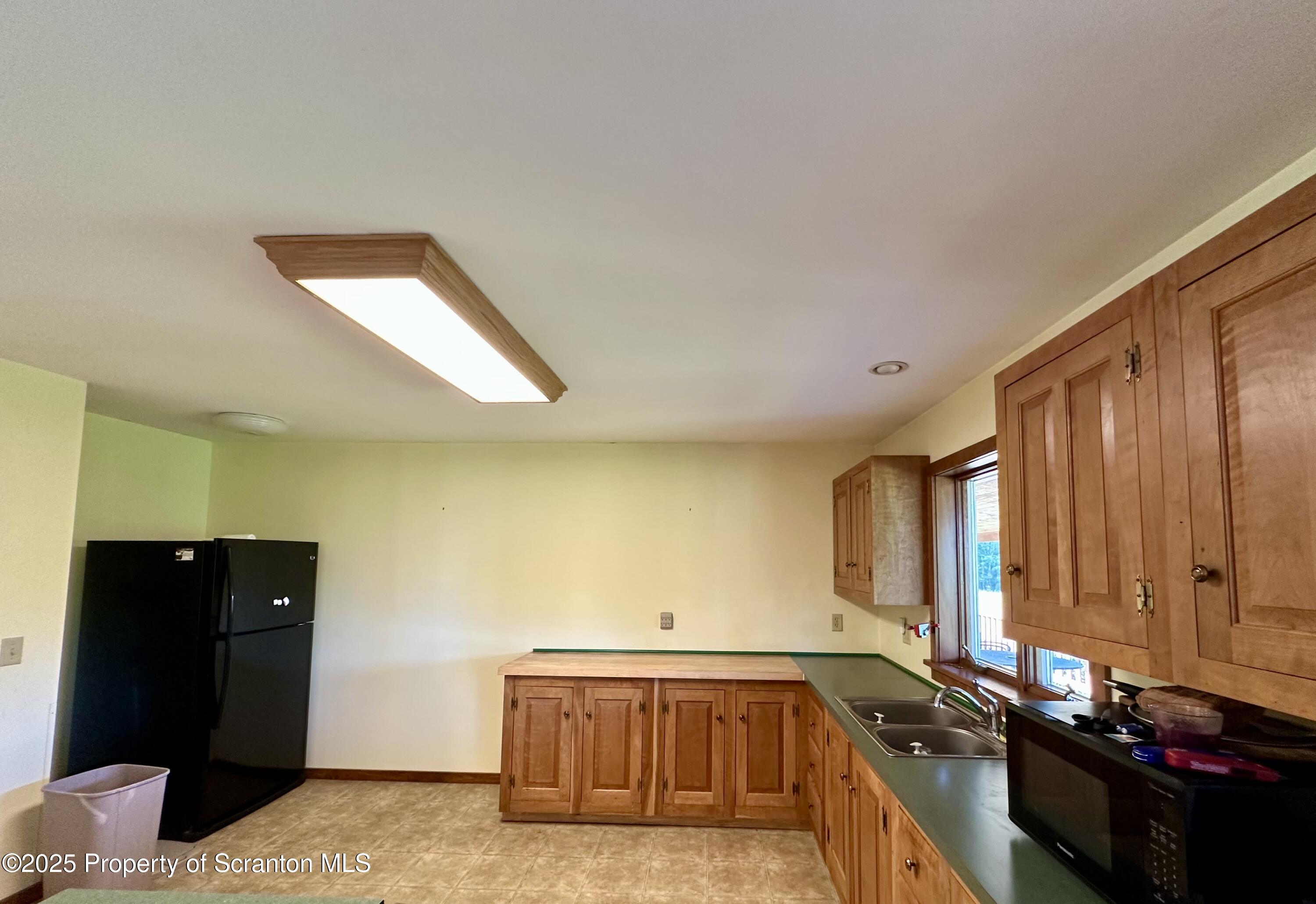 5290 Irish Hill Road Montrose, PA 18801 - Photo 17 of 67 a view of a kitchen with a sink