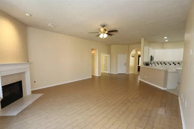 a view of a kitchen with a sink and a fireplace