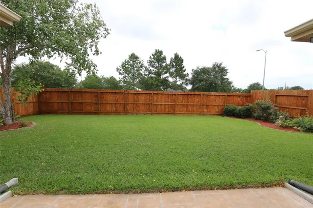 a view of backyard with green space