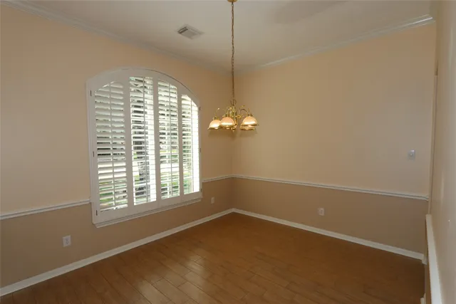 a view of a room with blue walls and a window