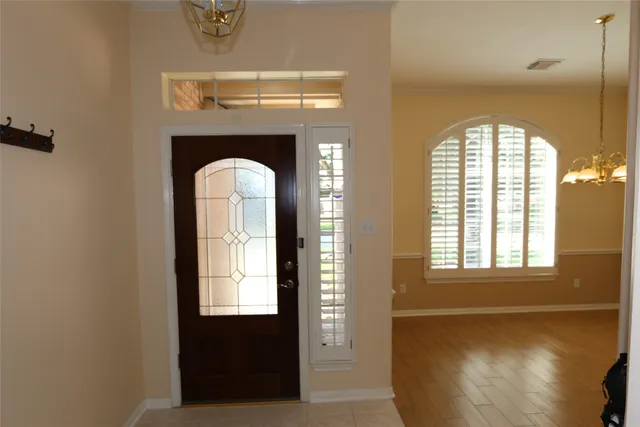 a view of a livingroom with wooden floor and window
