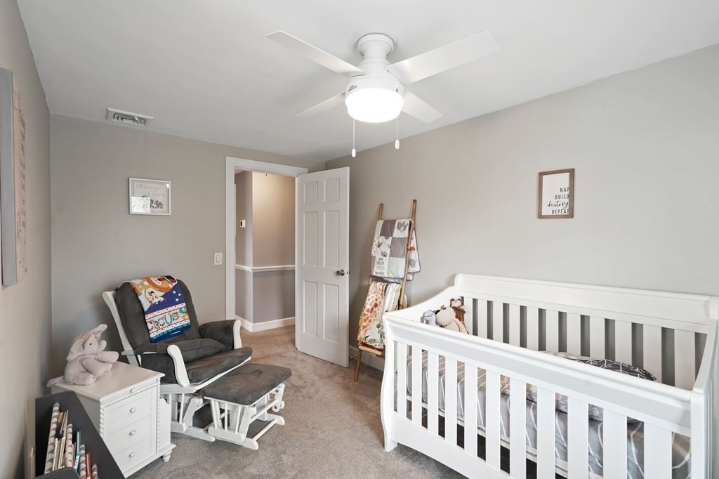 53 Pond Street Canton, MA 02021 - Photo 20 of 31 a bedroom with furniture and a window