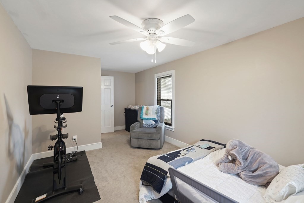 53 Pond Street Canton, MA 02021 - Photo 24 of 31 a room with furniture and a chandelier