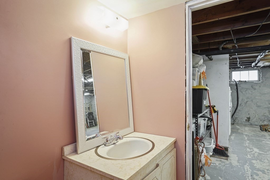 53 Pond Street Canton, MA 02021 - Photo 26 of 31 a bathroom with a sink a mirror and shower